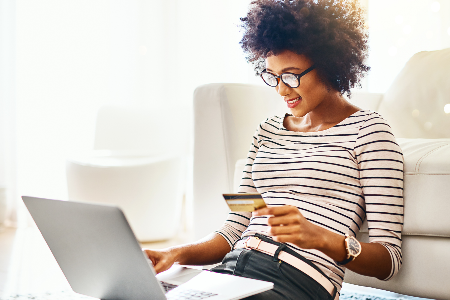 Woman shopping online using bank card
